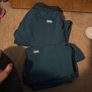 Figs Top xxs and bottoms Xs selling each piece for 30 bucks